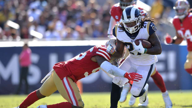 Los Angeles Rams running back Darrell Henderson (27) is tackled by San Francisco 49ers middle linebacker Kwon Alexander (56)